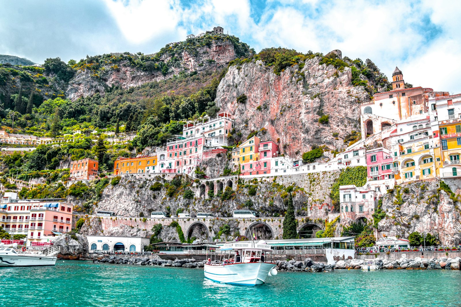 Amalfi town climbing the cliffs above its harbor on the Amalfi Coast
