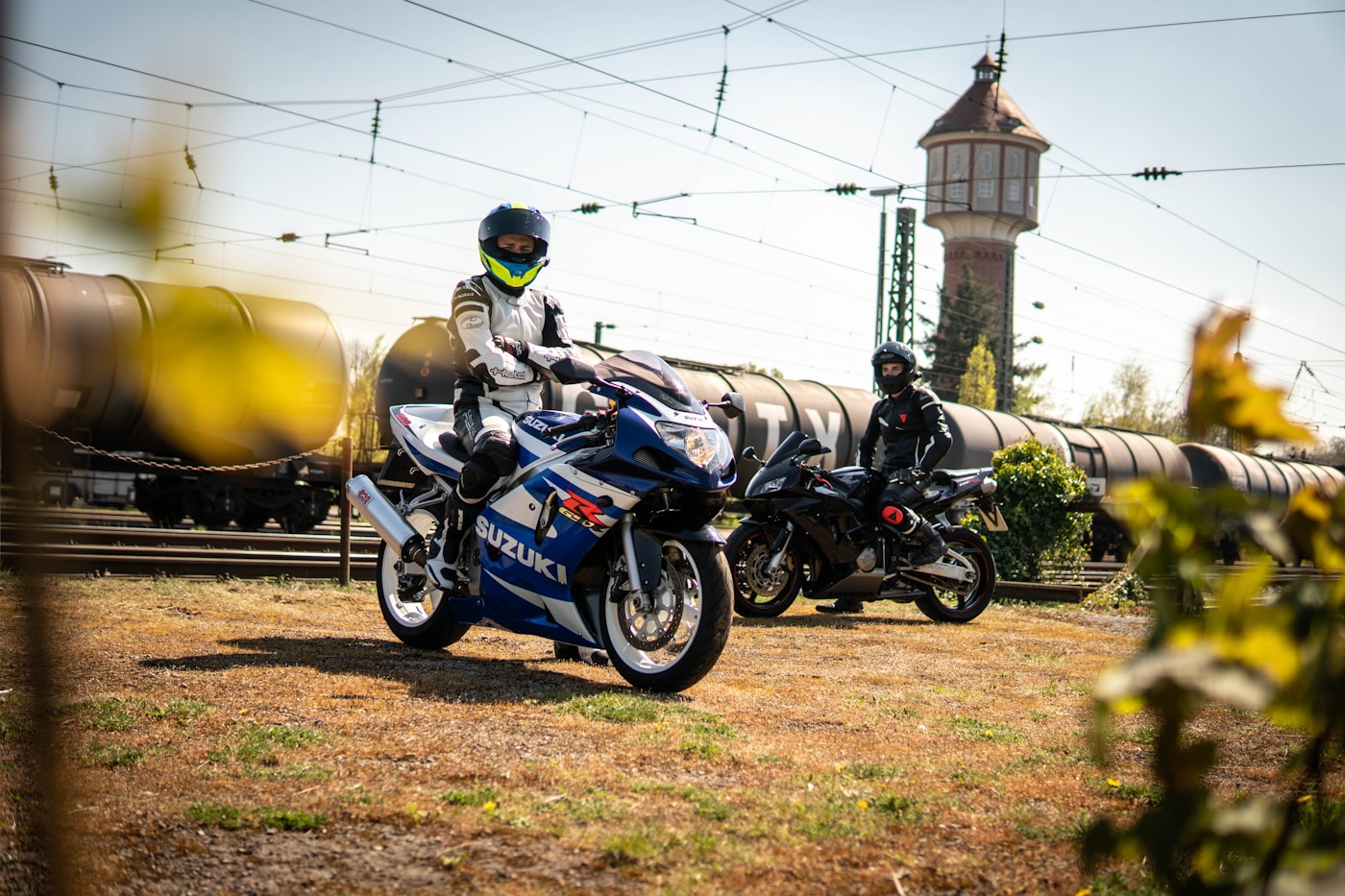 Motorcycles on an open two-lane road through rural countryside
